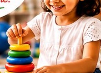 Child stacking rings during therapy